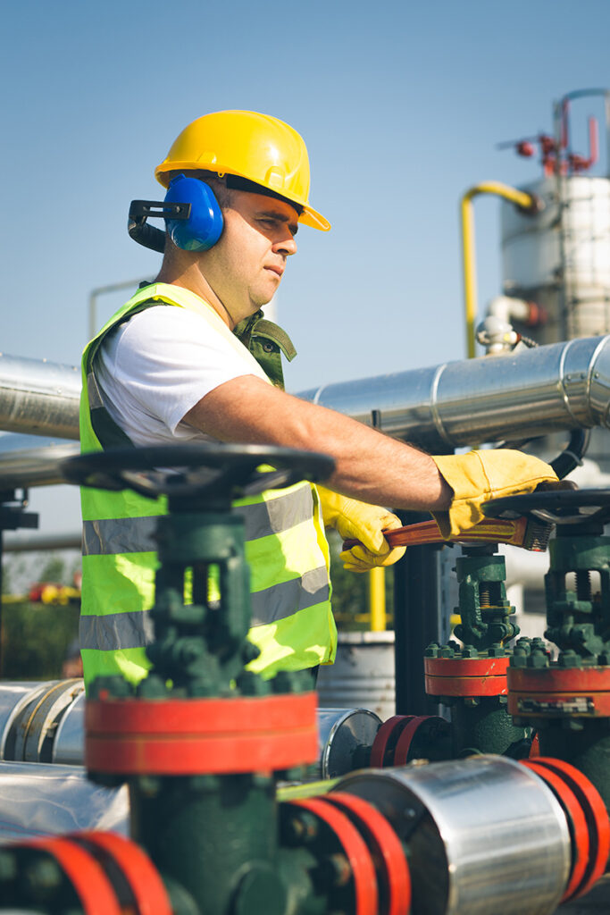 a man wearing a hard hat and earphones